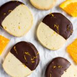 Overhead shot of chocolate orange slice 'n' bake cookies on parchment paper.