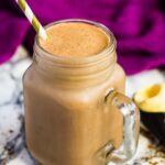 Nutella coffee milkshake in a mason jar with a straw.