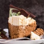 A slice of mint chocolate cream pie on a small white plate with a fork.