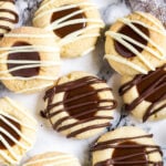 Overhead shot of thumbprint cookies with a chocolate caramel filling.