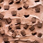 A close-up shot of creamy No-Churn Double Chocolate Ice Cream studded with chocolate chips.