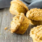 A scattered pile of Banana Crumb Muffins.
